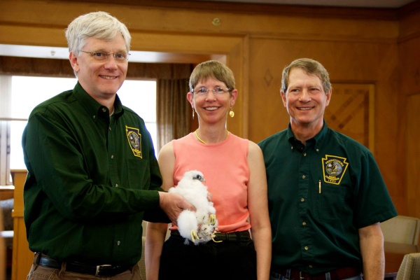 Dan Brauning (holding neslting), Kate St. John and Art McMorris at peregrine banding at the Cathedral of Learning, 17 May 2013 (photo by B. Rose Huber/University of Pittsburgh)
