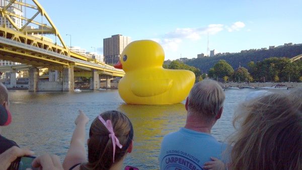 Giant rubber ducky about to go under the Ft. Duquesne Bridge, Pittsburgh, 27 Sep 2013 (photo by Kate St. John)