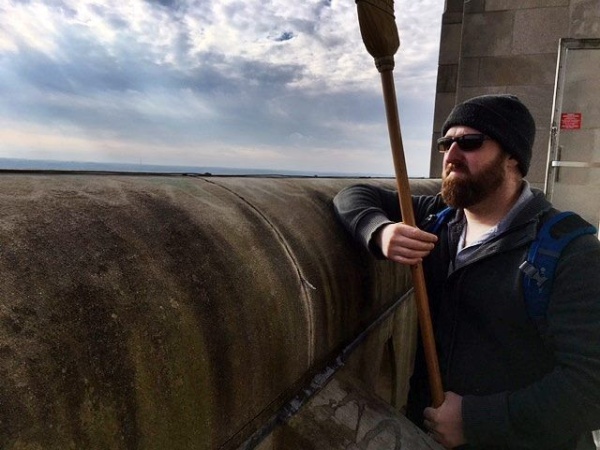 Jason holds the broom for head-protection (photo courtesy Bob Mulvihill, National Aviary)