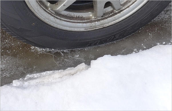 Tire in ice (photo by Kate St. John)
