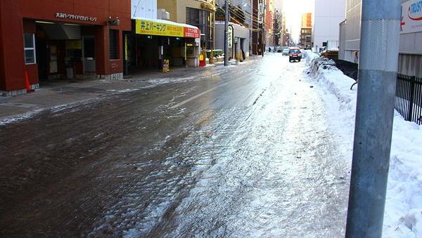 Transparent ice coating the street in Sapporo, Japan (photo from Wikimedia Commons)